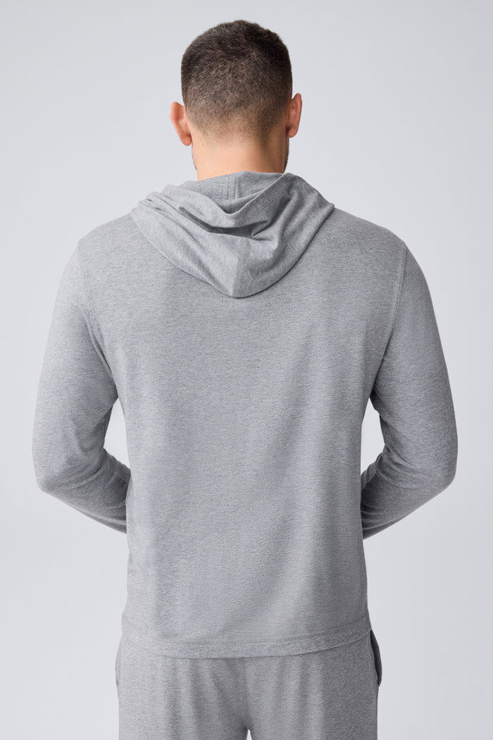 Back view of a man wearing 18-Hour Jersey Hoodie in Medium Grey Heather