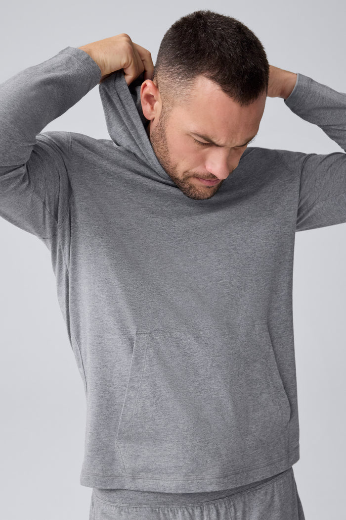 Detailed front view of a man wearing 18-Hour Jersey Hoodie in Medium Grey Heather