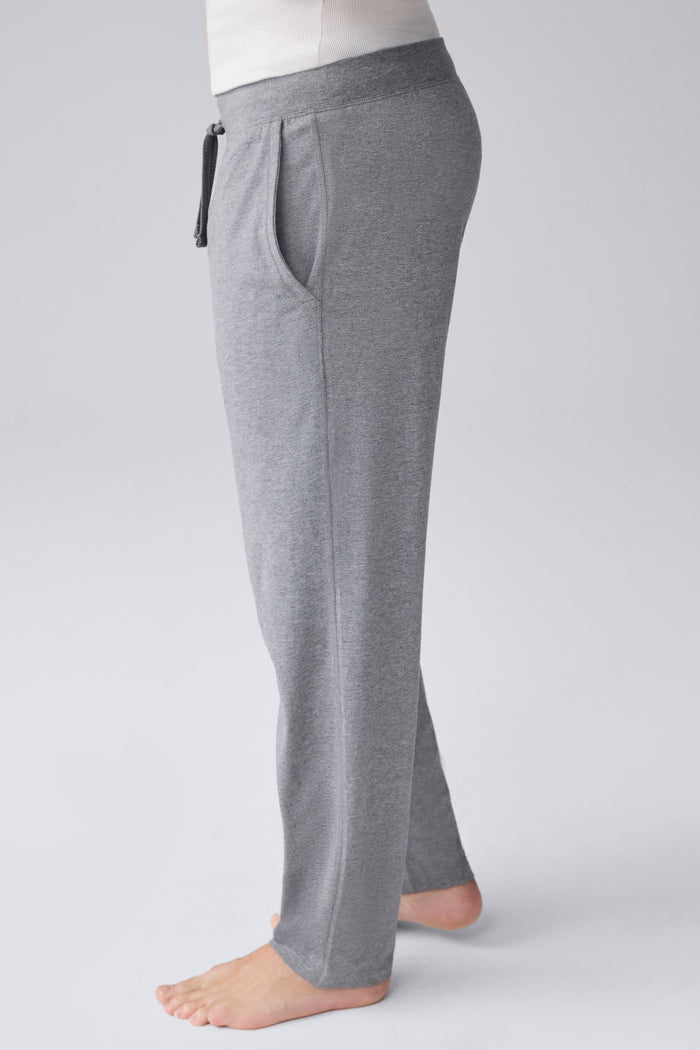 Side view of a man wearing 18 hour Jersey pant in Medium Grey Heather