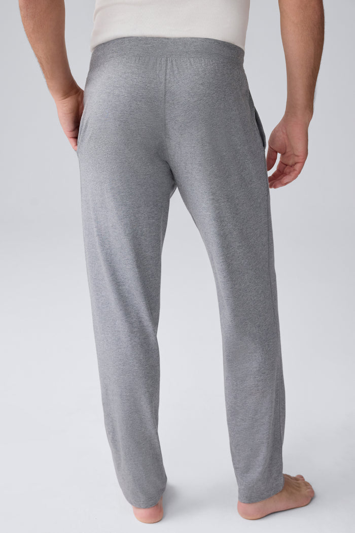 Back view of a man wearing 18 hour Jersey pant in Medium Grey Heather