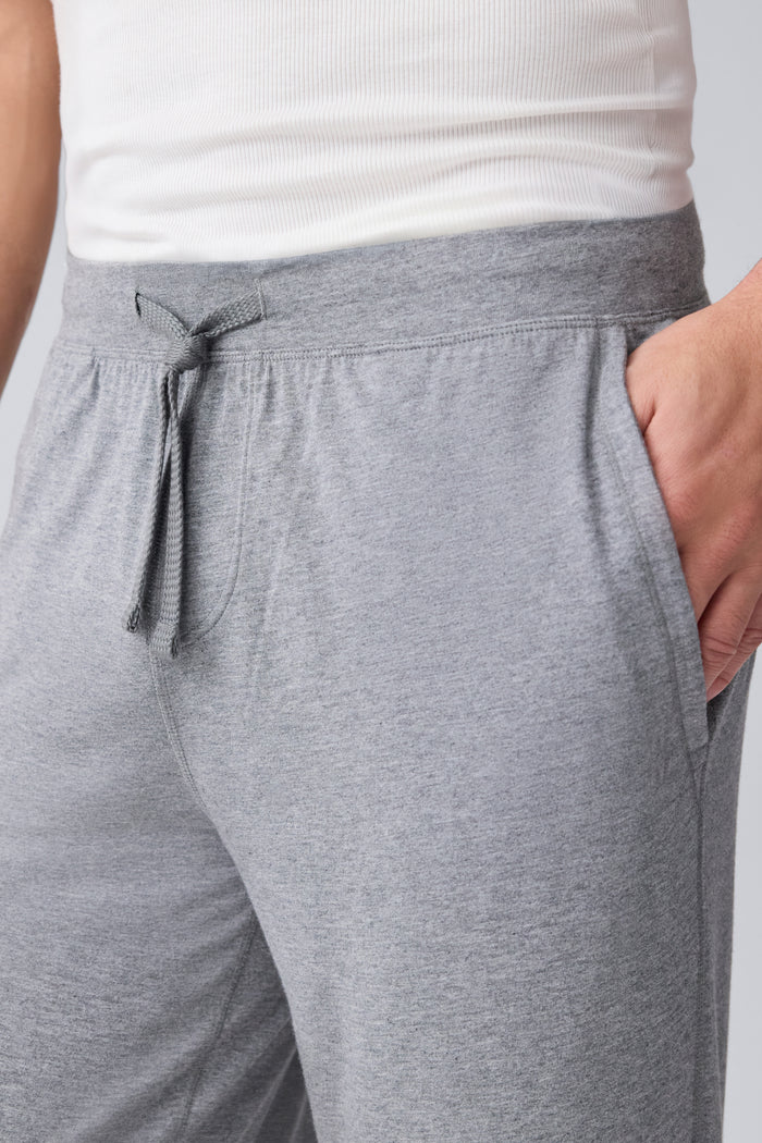 Detailed front view of a man wearing 18 hour Jersey pant in Medium Grey Heather