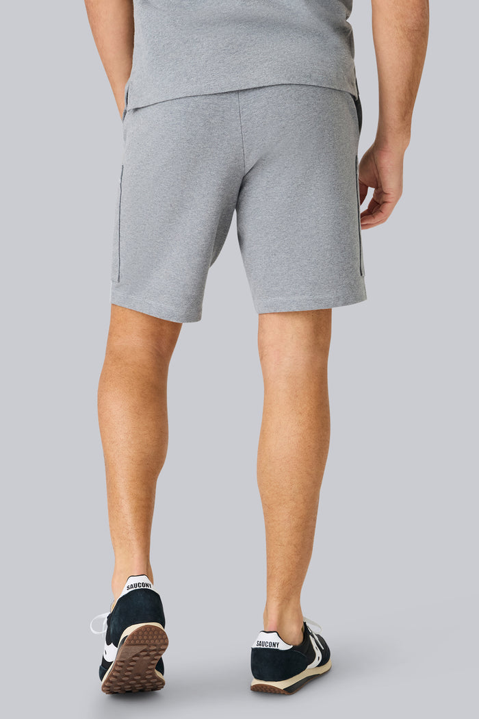 Back view of a man wearing Ace Cargo Sweatshort in Grey Heather
