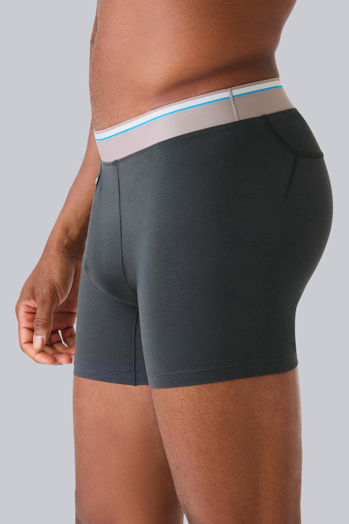 Side view of a man wearing Airknitx Cotton Boxer Brief w/ fly in Phantom