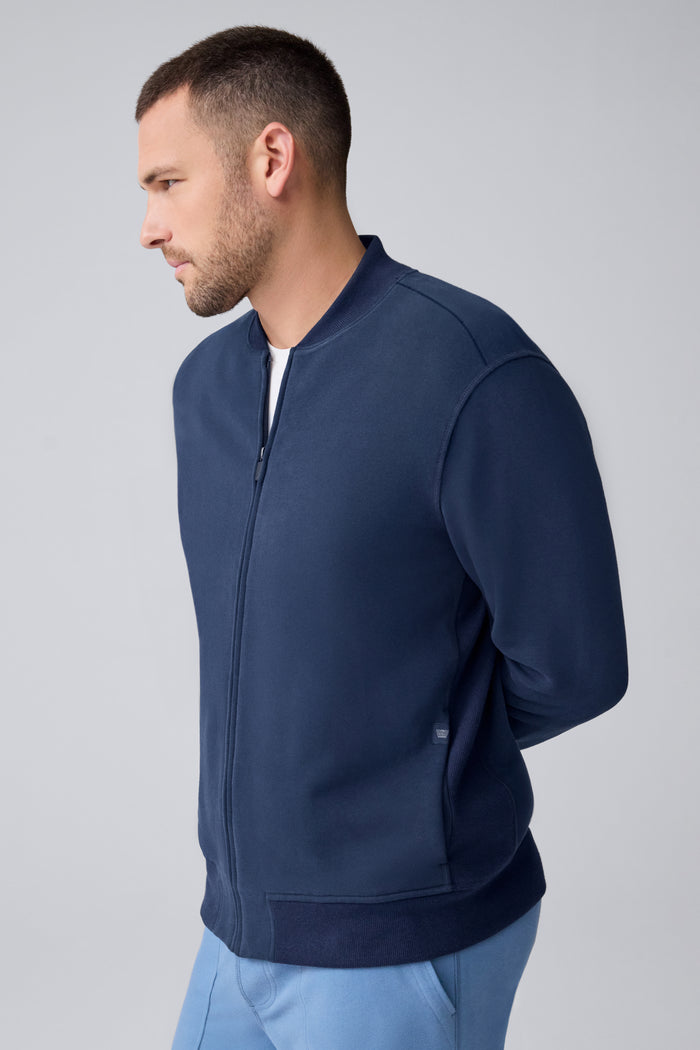 Side view of a man wearing Ace Bomber Jacket in Total Eclipse