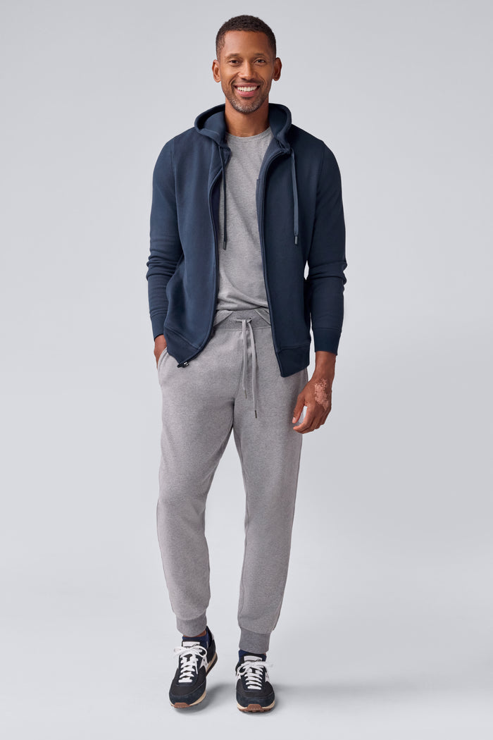 Full front view of a man wearing ACE Full-Zip Hooded Sweatshirt in Total Eclipse Blue