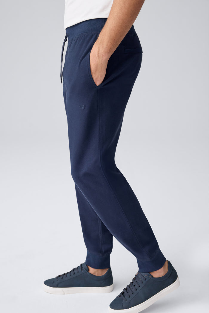 Side view of a man wearing Ace Relaxed Sweatpant in Total Eclipse