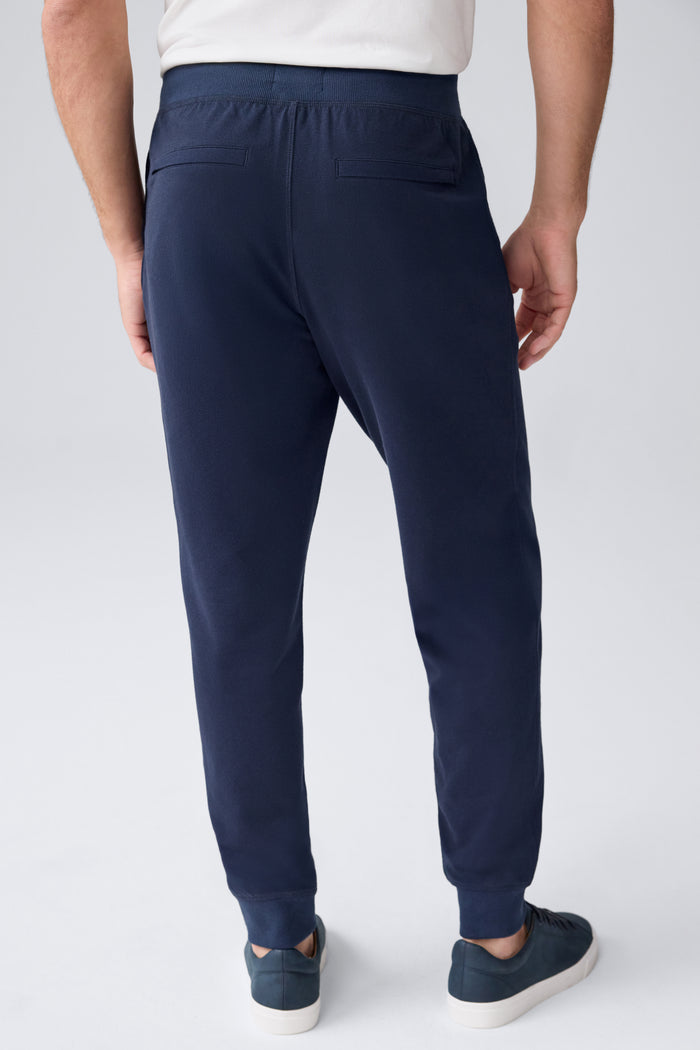 Back view of a man wearing Ace Relaxed Sweatpant in Total Eclipse