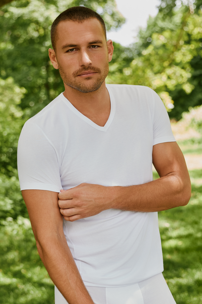 Man wearing Airknitx Cotton v-neck undershirt in Bright White