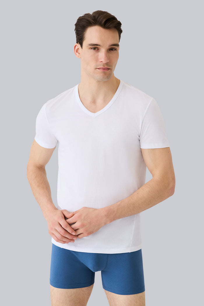 Front view of a man wearing AIRKNITx Cotton V-Neck Undershirt in Bright White