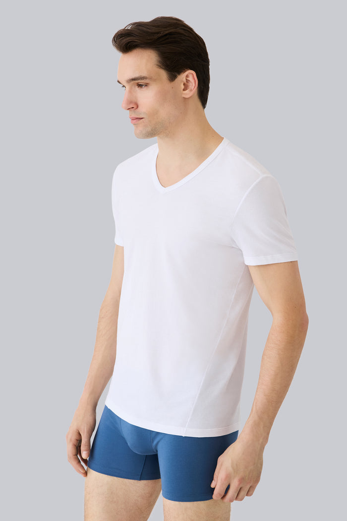 Side view of a man wearing AIRKNITx Cotton V-Neck Undershirt in Bright White