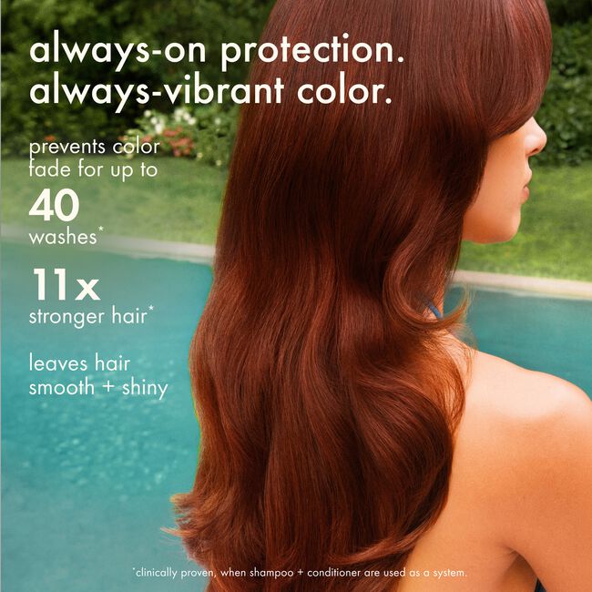 A woman shown from the back with long, wavy reddish-brown hair standing by a swimming pool. White text on the left reads: 'always-on protection.