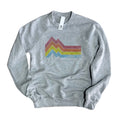 A gray sweatshirt with a colorful striped mountain graphic on the front.