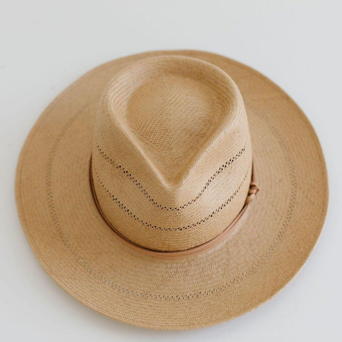 A honey colored straw fedora hat with a hat band on a plain background #color_honey