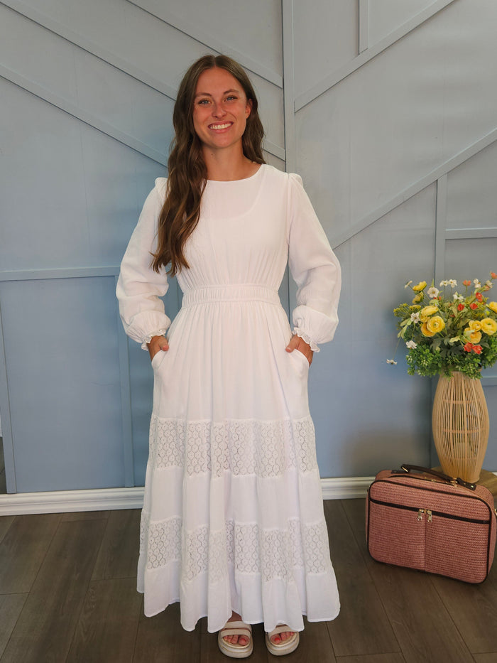 White dress with lace panel skirt.
