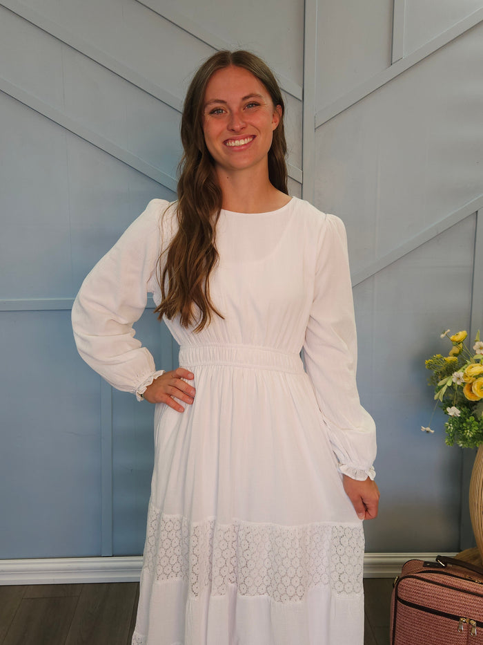 White dress with lace panel skirt.