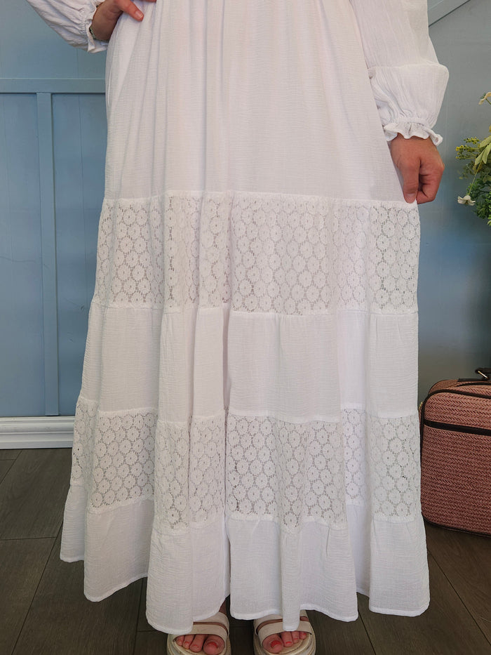 White dress with lace panel skirt.