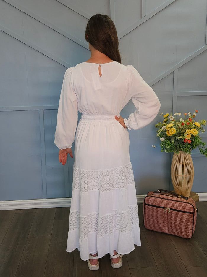 White dress with lace panel skirt.