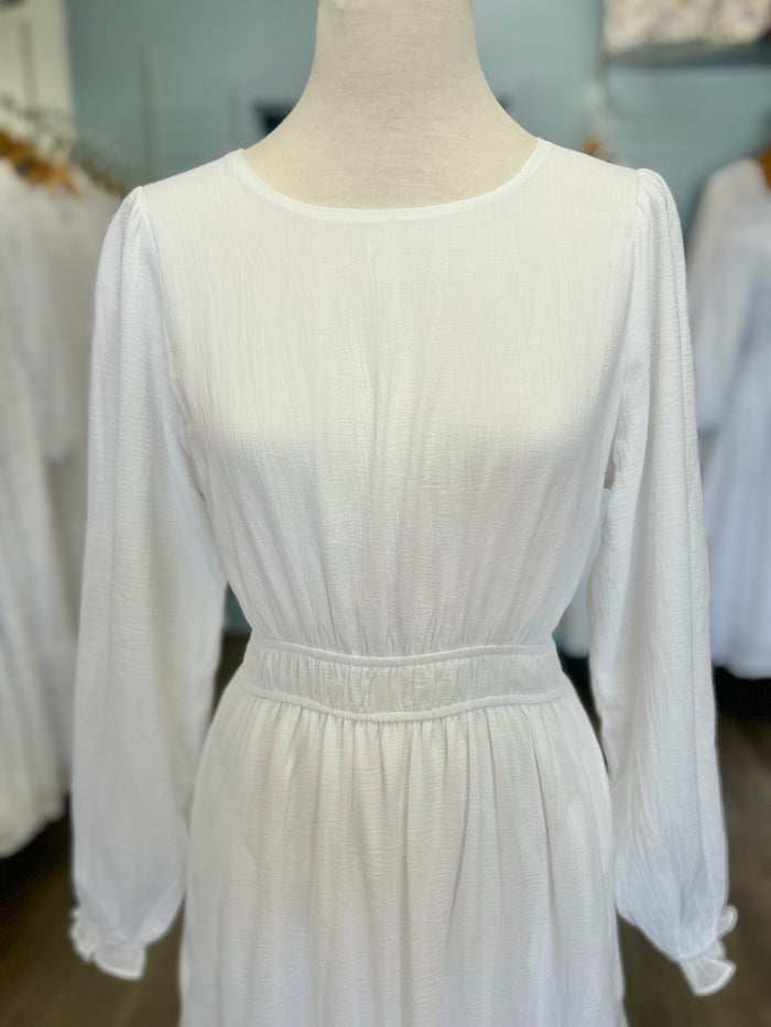 White dress with tiered lace panel skirt.