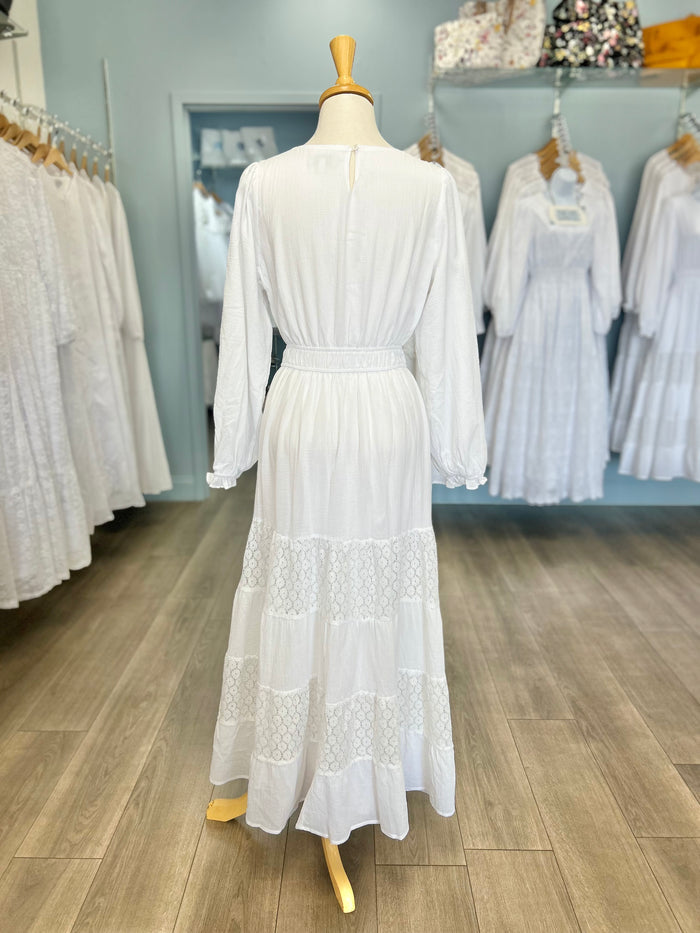 White dress with tiered lace panel skirt.