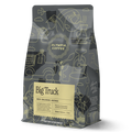 Big Truck coffee bag with yellow label and intricate abstract line art on a dark package