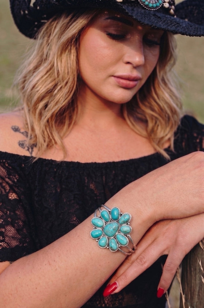 Turquoise western cuff bracelet styled for gothic cowgirl outfits, country concert fashion, boho western looks and rodeo style from Sand + Charcoal Boutique.