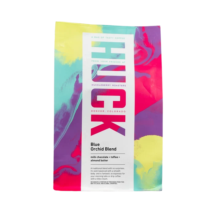Full view of a vibrant Blue Orchid Blend coffee bag with bold abstract artwork and white label
