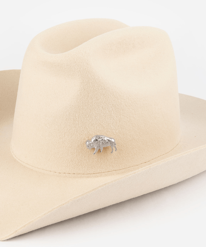 Pink cowboy hat with a silver buffalo-shaped hat pin on a white background #color_silver