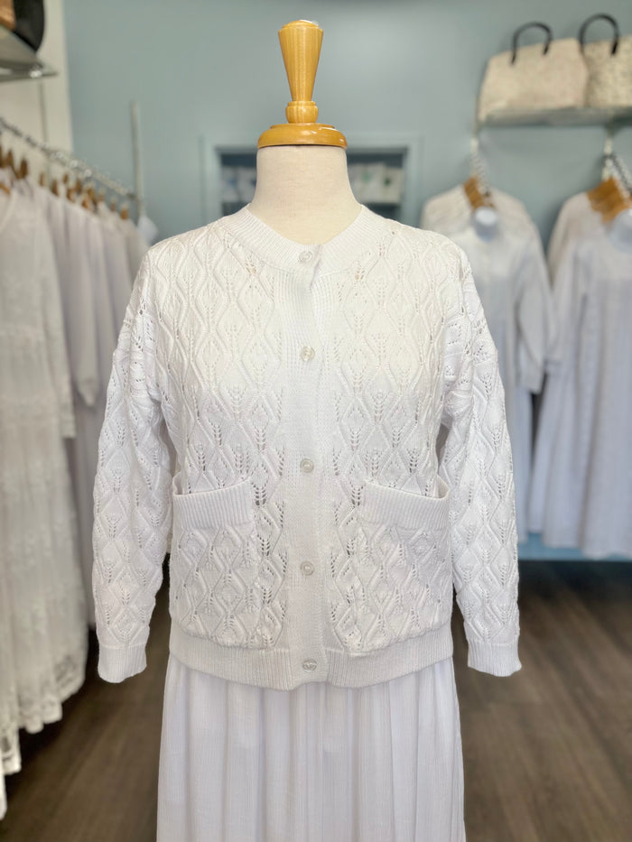 White cable knit button up cardigan.