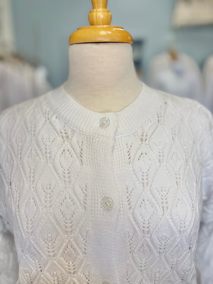White cable knit button up cardigan.