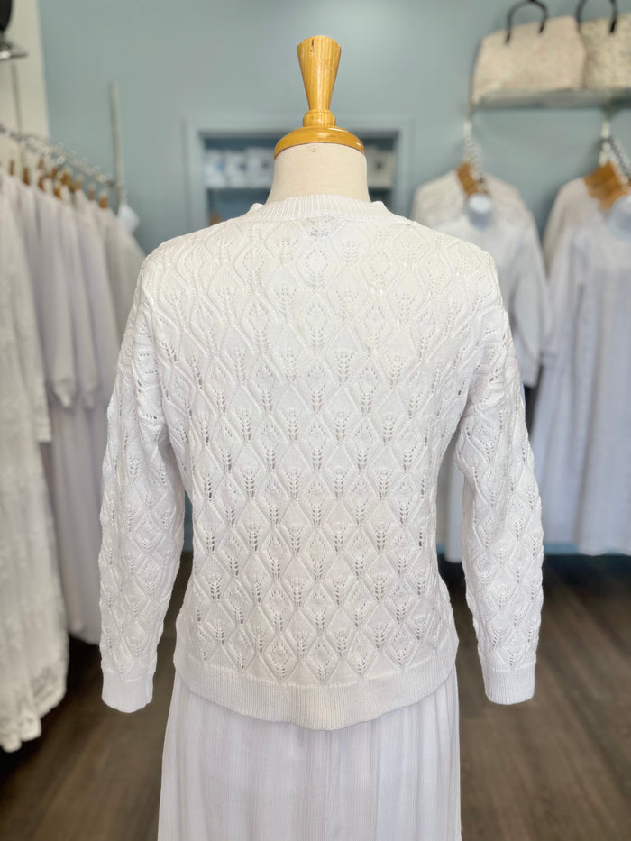 White cable knit button up cardigan.