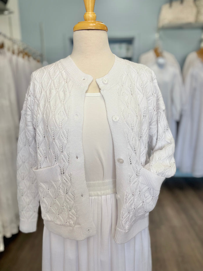 White cable knit button up cardigan.