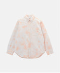 Model wearing a Gramicci peach Bleach Stripe colored Classic Oxford Bleached Shirt against a light-tone background.