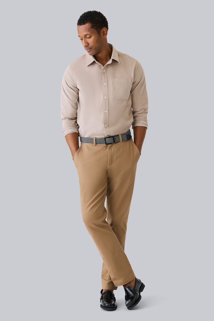 Full front view of a man wearing Corduroy Button Up Shirt in Stone