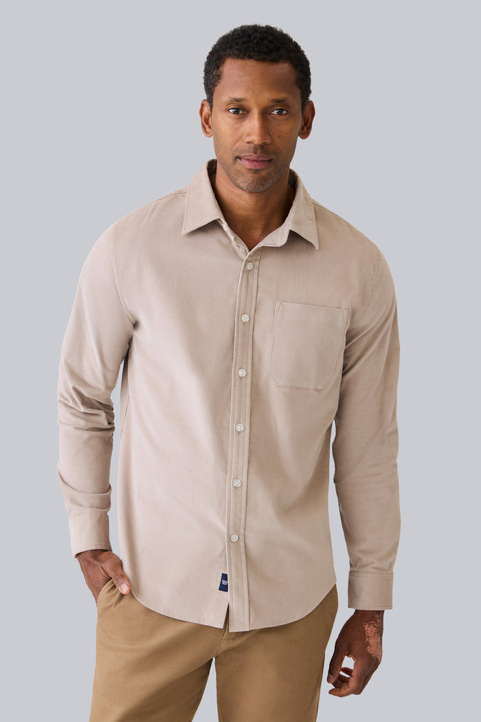 Front view of a man wearing Corduroy Button Up Shirt in Stone
