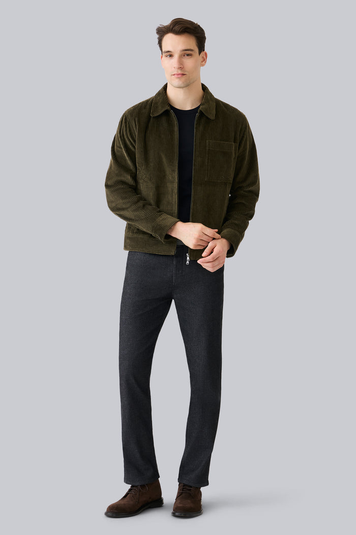 Full front view of a man wearing Corduroy Zip Jacket in Dark Olive