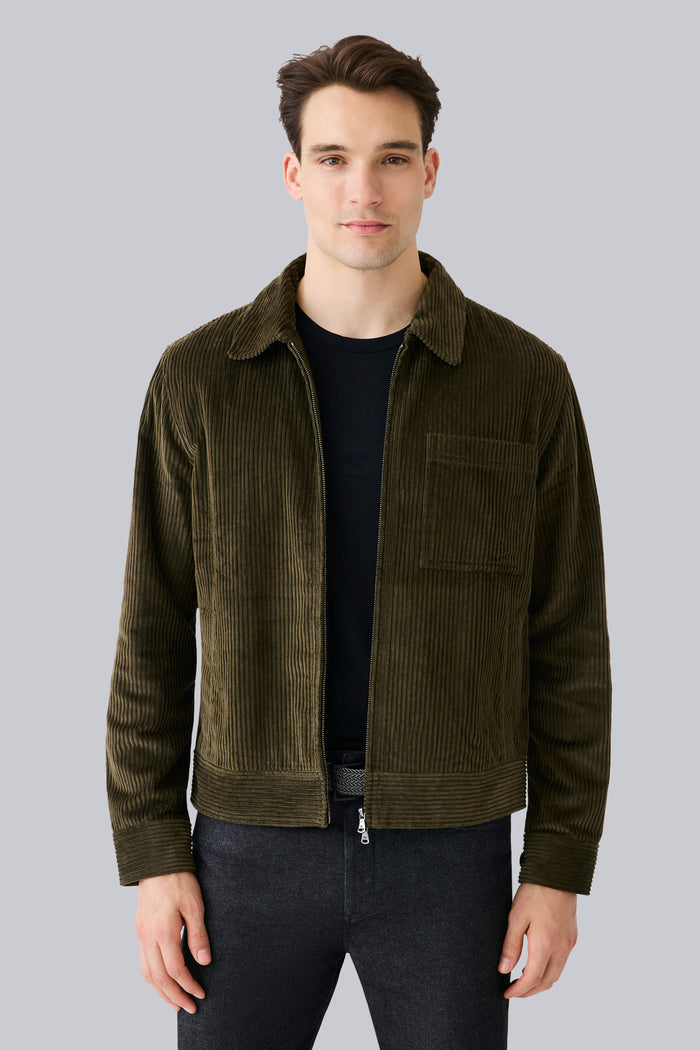 Front view of a man wearing Corduroy Zip Jacket in Dark Olive