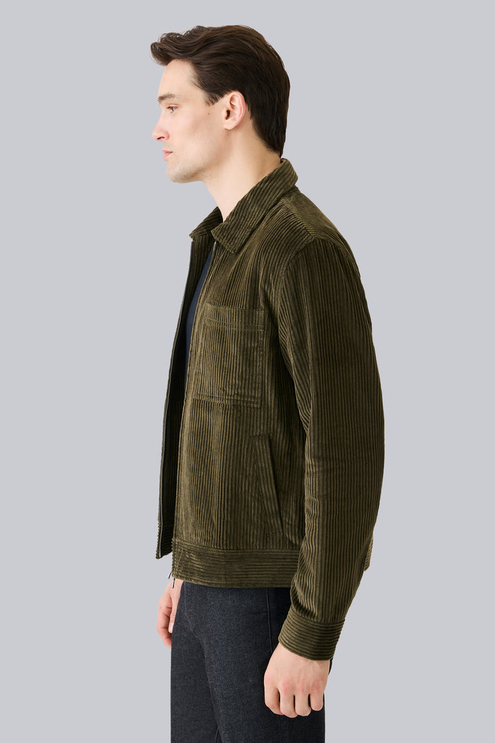 Side view of a man wearing Corduroy Zip Jacket in Dark Olive