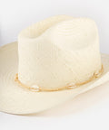 Beige straw hat with decorative band on a plain background #color_cream