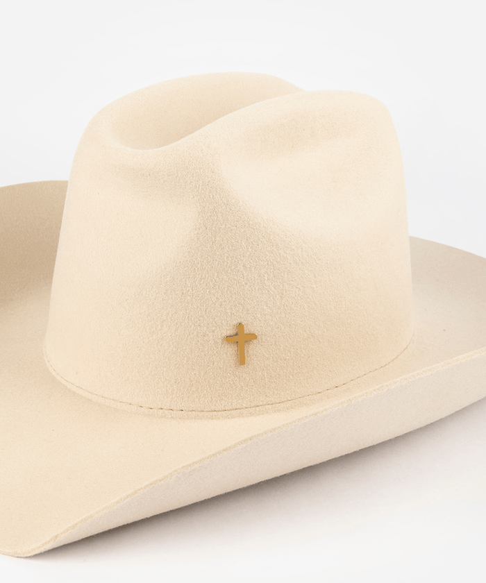 Pink cowboy hat with a gold cross-shaped hat pin on a white background #color_gold