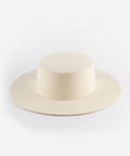 An off white boater-style hat on a plain background #color_off white