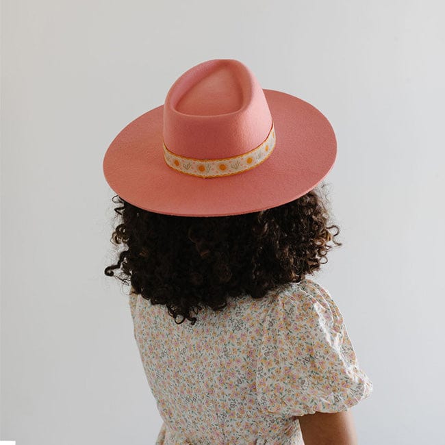 Person wearing a pink Dakota Dae Triangle Crown hat with a band and a light colored top, facing behind  against a plain background #color_pink