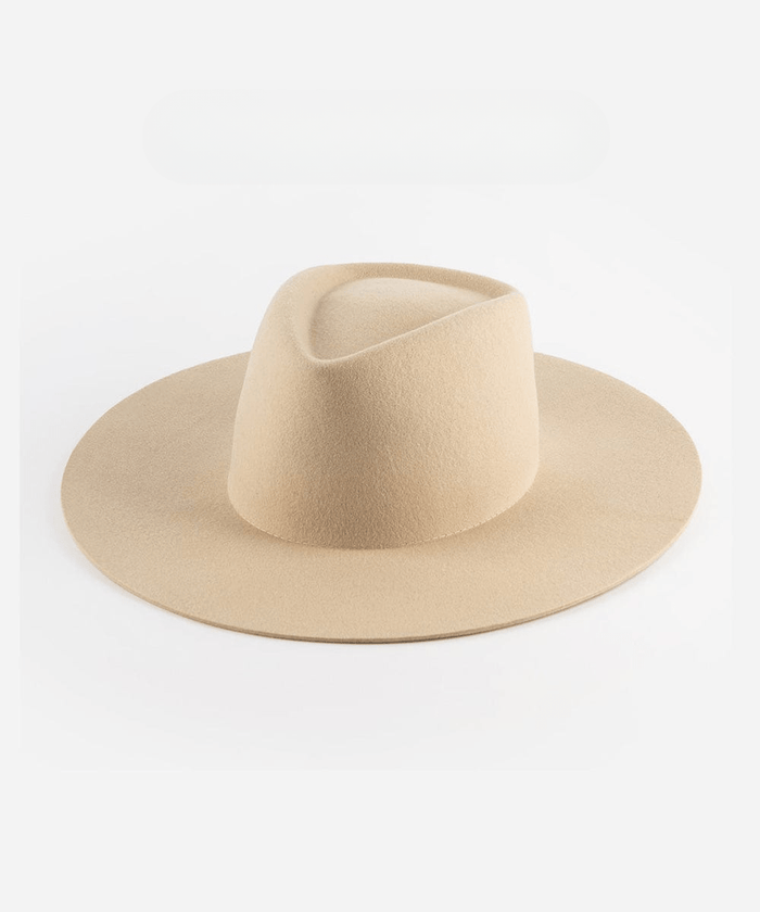 A cream wide brim felt hat with a triangle crown on a plain background #color_cream