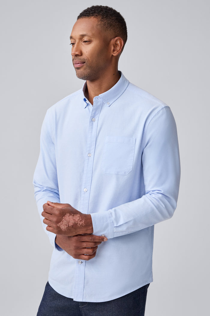 Side view of a man wearing Dean Oxford Shirt in Dean Blue / White