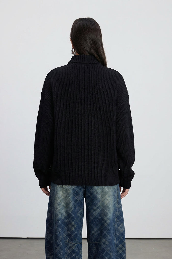 Emel Turtleneck Twist Knit Top In Black