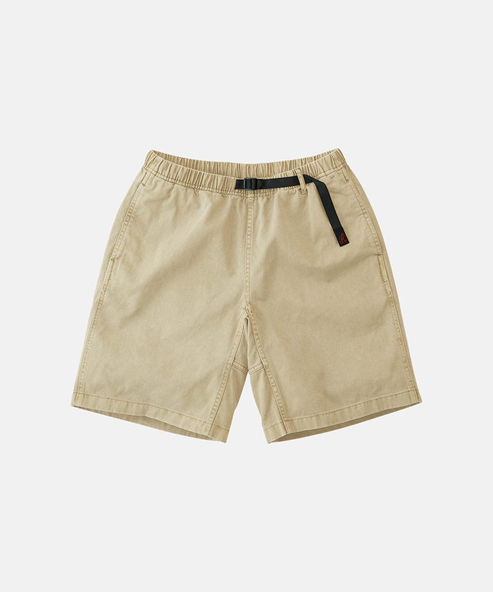 Beige pigment dye Gramicci G-Shorts with a belt against a light-tone background.