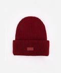 Burgundy knit beanie with a small patch on a white background #color_burgundy