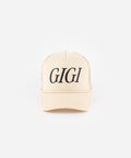 A cream cap with 'GIGI' text on a white background #color_cream