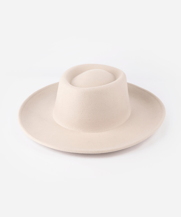 Gambler hat with an indented oval crown and an upturned brim against a white background #color_ivory