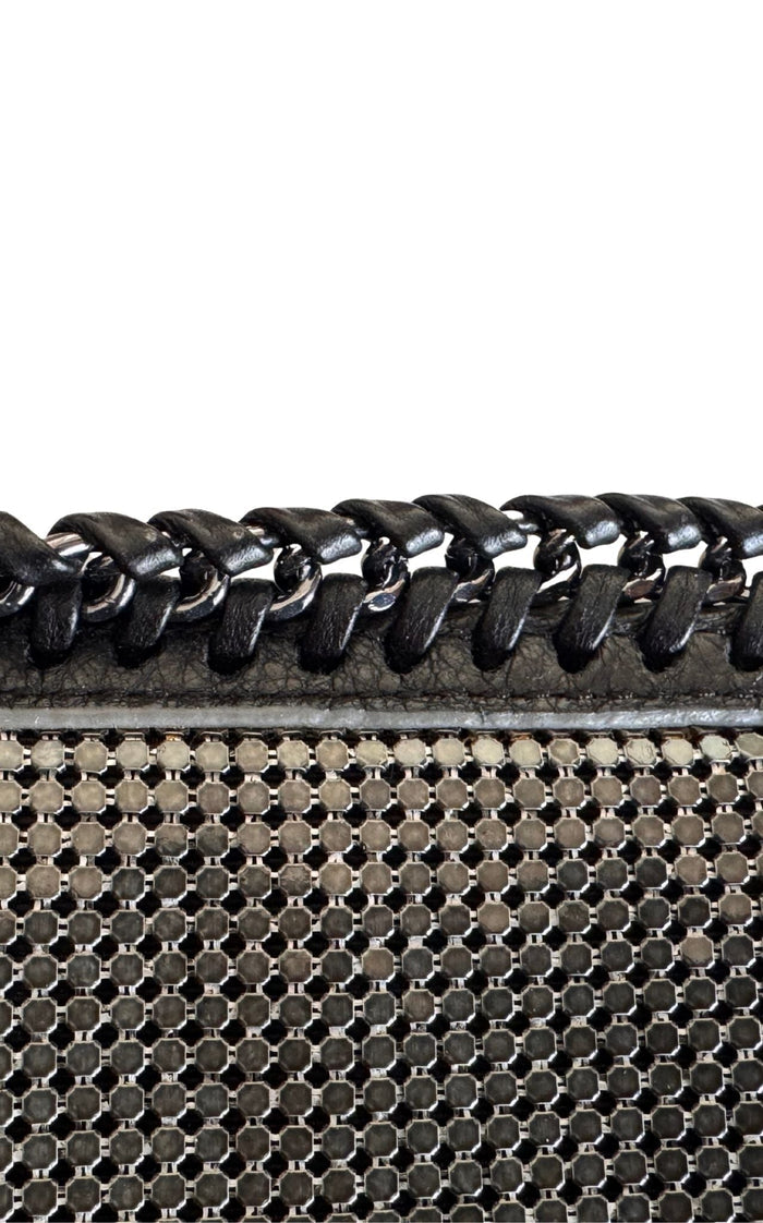 BCBG Max Azria gunmetal metal mesh clutch with leather whipstitch trim and tassel