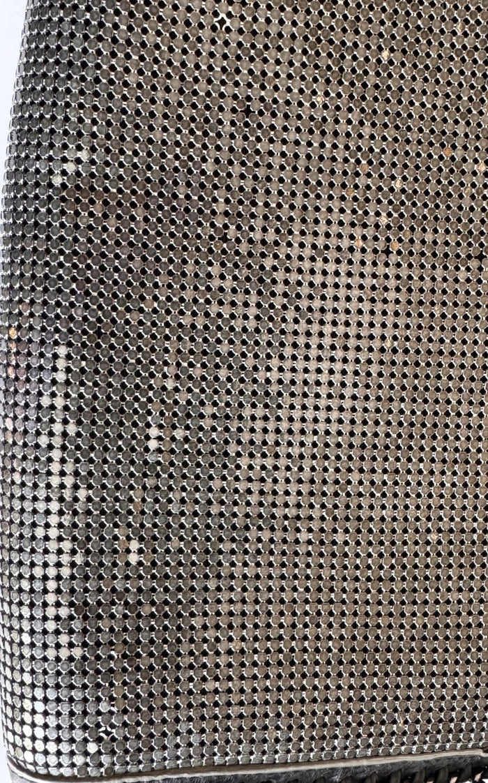 BCBG Max Azria gunmetal metal mesh clutch with leather whipstitch trim and tassel